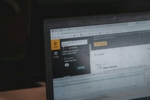 Feedbuzzard code explained with a computer monitor showing website code