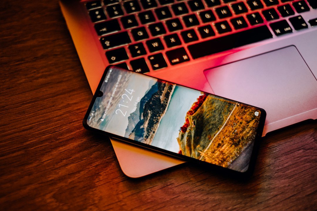 Feedbuzzard com latest articles read on a smartphone next to a laptop