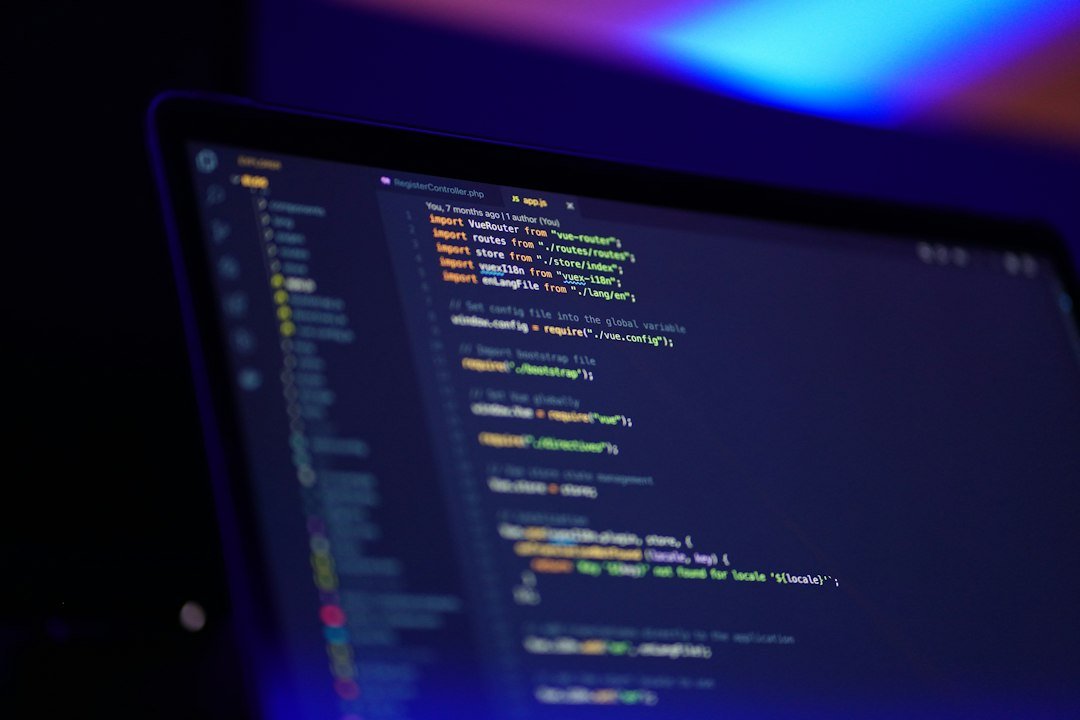 Laptop screen displaying colorful code used to learn software development