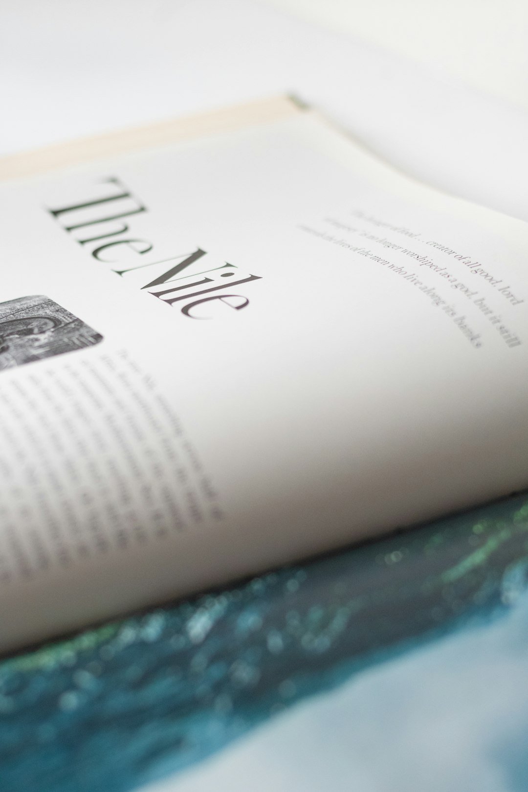 Open printed book on a table showing a clean page layout with text and images
