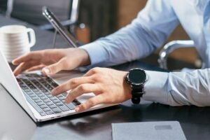 Software automation wbsoftwarement guide shown with a person typing on a laptop at a desk